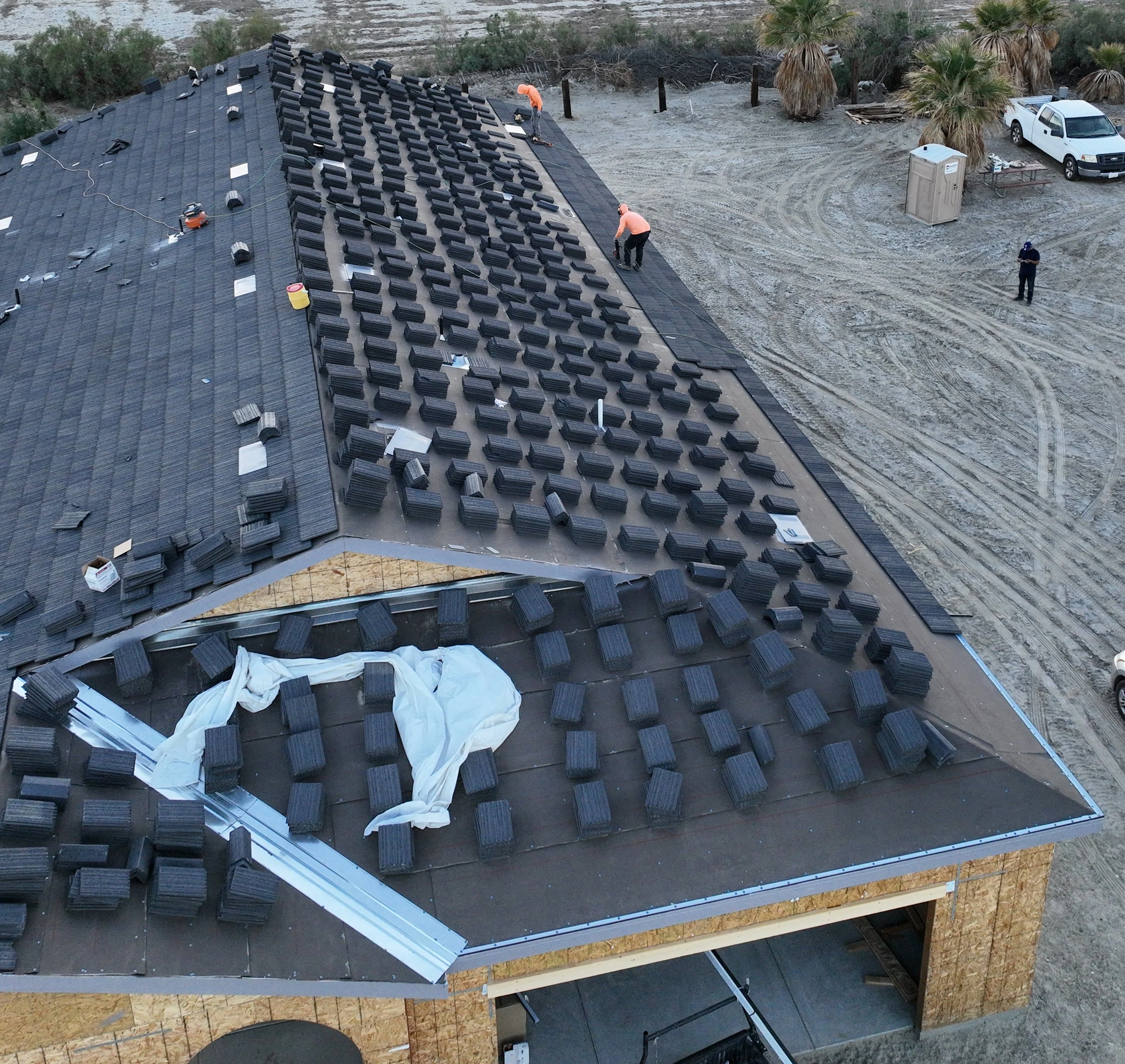 Professional roofing contractor working on a residential roof